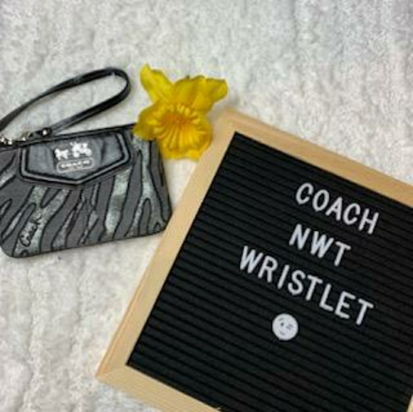 Coach Handbags - NWT Coach Black and Silver Zebra Print Wristlet